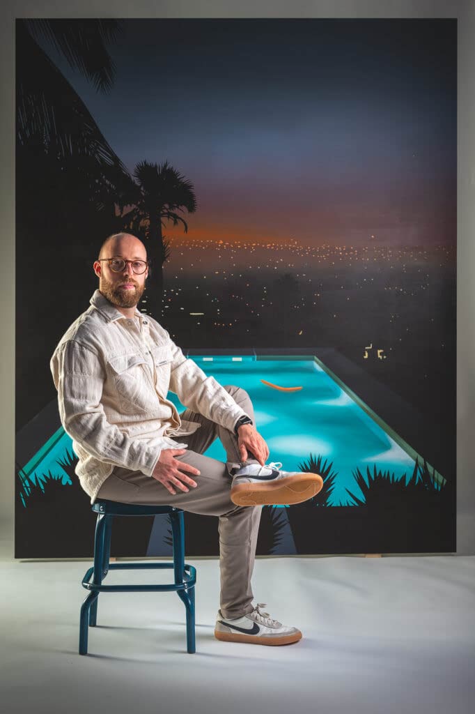 Studio Portrait of artist in front of large scale painting